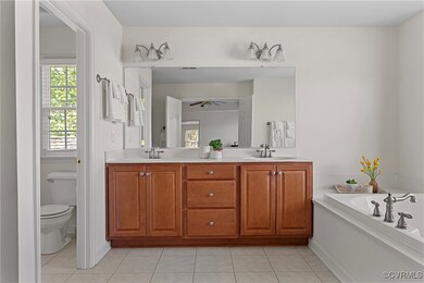 A large Primary Bathroom with Dual Sinks, Soaking