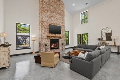 Two story family room with gorgeous brick fireplace