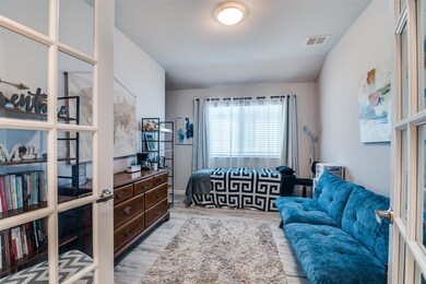 Bedroom featuring wood finished floors and visible