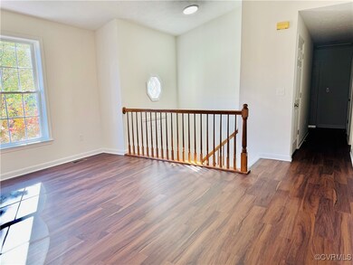 Spare room with dark hardwood / wood-style floorin