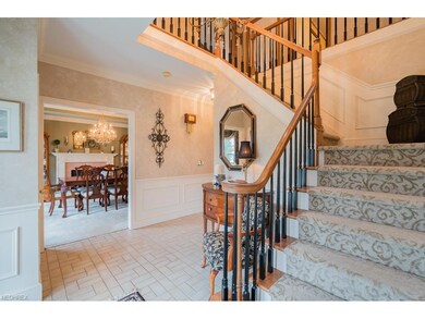 Gracious two-story foyer with turned staircase. Fo