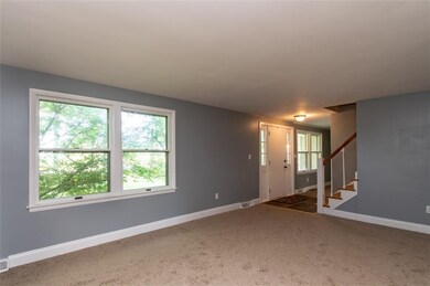 Living room looking to the entrance way.