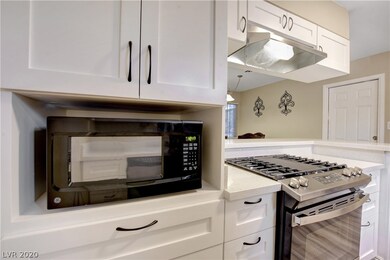 Kitchen has brand new custom cabinets and a high e