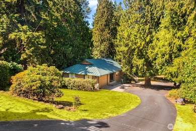 Neatly tucked away yet close to all the amenities, you'll find this well maintained home on an acre+ lot, plenty of additional parking, a huge shop and Northshore Schools.  Main floor primary bedroom!