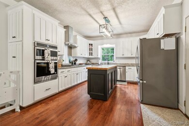 Kitchen featuring stainless steel appliances, whit