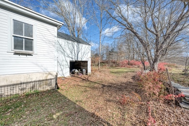 Side of Home Showing the Attached Carriage Shed