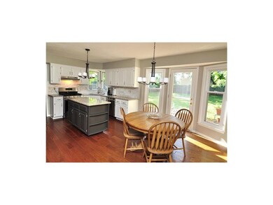 Granite counters, stainless appliances and subway 