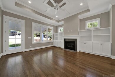 Enjoy the living room with gleaming hardwoods thro