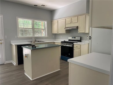 Kitchen featuring stainless steel gas range oven, 