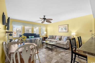 Living room featuring ceiling fan