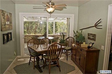 Kitchen breakfast nook with ceiling fan and peacef