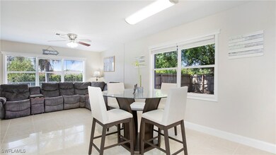 Dining area featuring baseboards, ceiling fan, vis