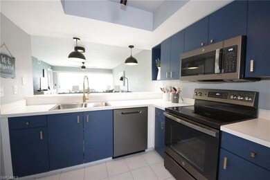 Kitchen featuring stainless steel appliances, blue
