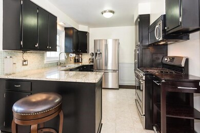 Stainless, granite and espresso kitchen
