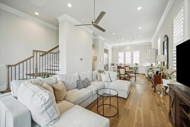 Second floor living combines the kitchen, dining,