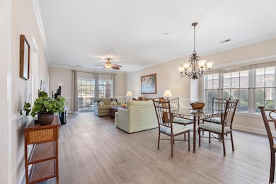 Dining area featuring ceiling fan with notable cha