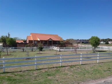 View of stable featuring a rural view