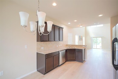 Kitchen featuring a peninsula, light wood finishe