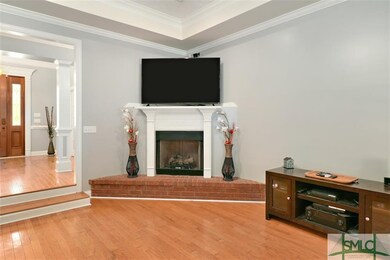 FOYER LEADS YOU TO THE GREAT ROOM WITH WOOD FLOORS