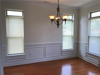 Formal Dining Room with chair rail, wainscoting & 