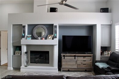 Family room is accented with two built-in cupboard