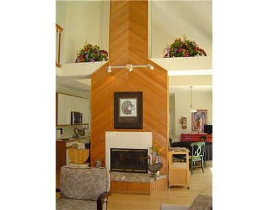 Living Room. Double sided fireplace warms the livi