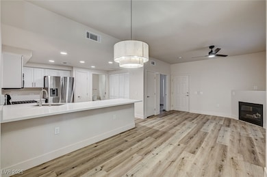 Kitchen featuring stainless steel fridge with ice