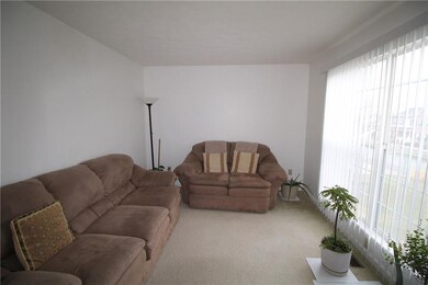 The living room could also be a home office or pla