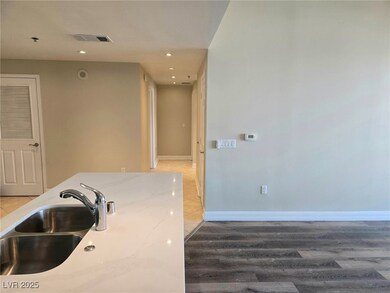 Kitchen featuring light stone countertops, visible