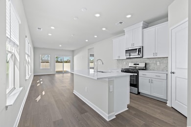 Kitchen featuring sink, hardwood / wood-style floo