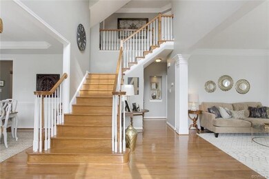 Gorgeous 2-story Foyer with Front and Rear Stairca