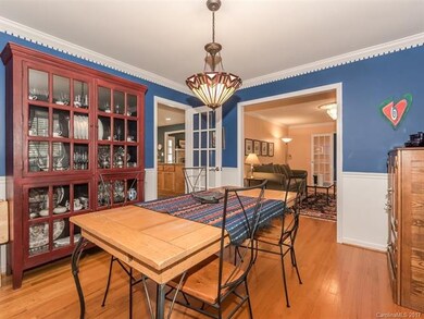 The Formal Dining Room is furnished with Hardwood 