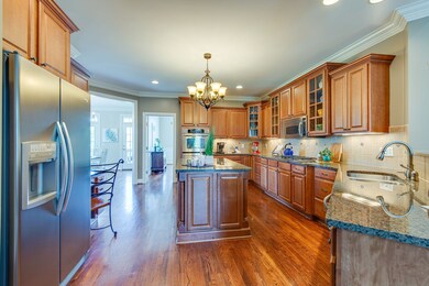 This huge island has so much storage and the double sink is perfect for many handwashing and dish washing.