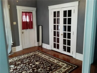 Living Room with view of French Doors to BR1