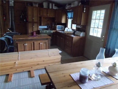 Kitchen/dining area with lumber on...