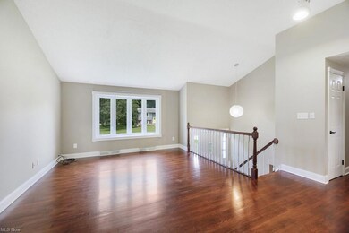 Upstairs living area has vaulted ceilings and hard