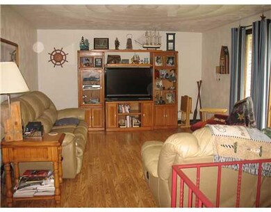 Living Room. Plaster walls and laminate floor.