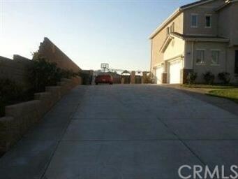 Driveway with fenced in RV Parking