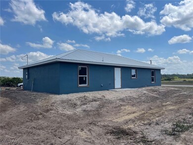 View of property exterior featuring stucco siding