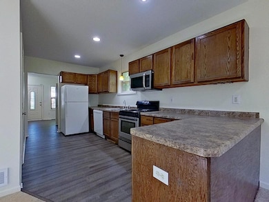 New flooring in kitchen, mudroom and both full baths.