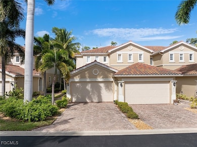Mediterranean / spanish home with stucco siding, decorative driveway, a tiled roof, and a residential view