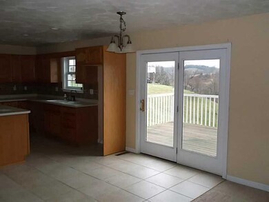 Kitchen. Eat-in area with access to rear patio
