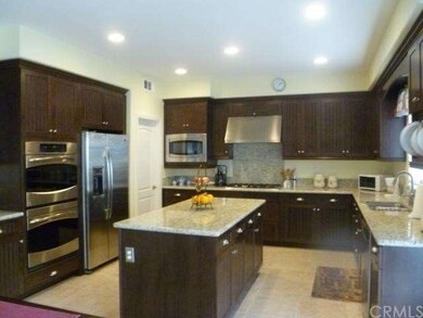 Beautiful Kitchen. Large island, dark wood cabinet