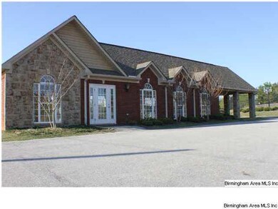 CLUBHOUSE THAT IS ADJACENT TO THE POOL