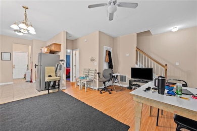 Office area featuring light wood-style floors, vis