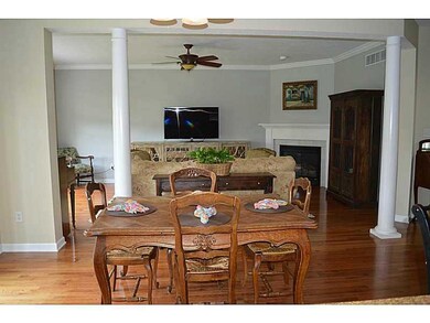Living Room. Stately columns provide separation be