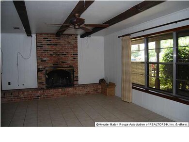 Living Room with wall of windows that look out on to courtyard.