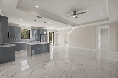 Kitchen with stainless steel refrigerator with ice