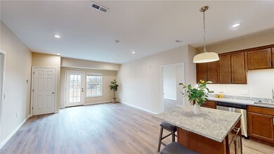 Large eat in kitchen open to living room and priva