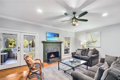 Large family room features French doors that lead